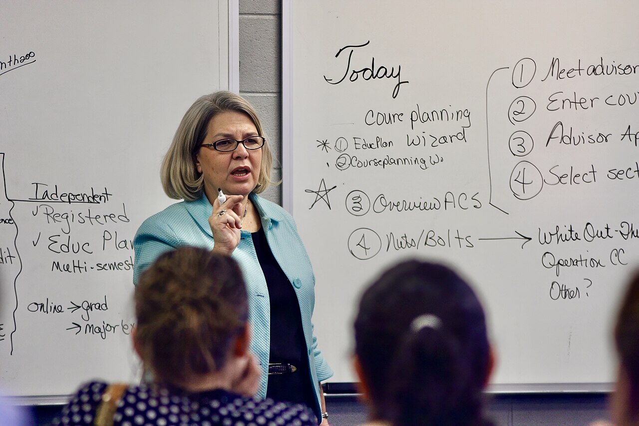 A college professor teaching in a university classroom full of students in Tennessee, United States 08