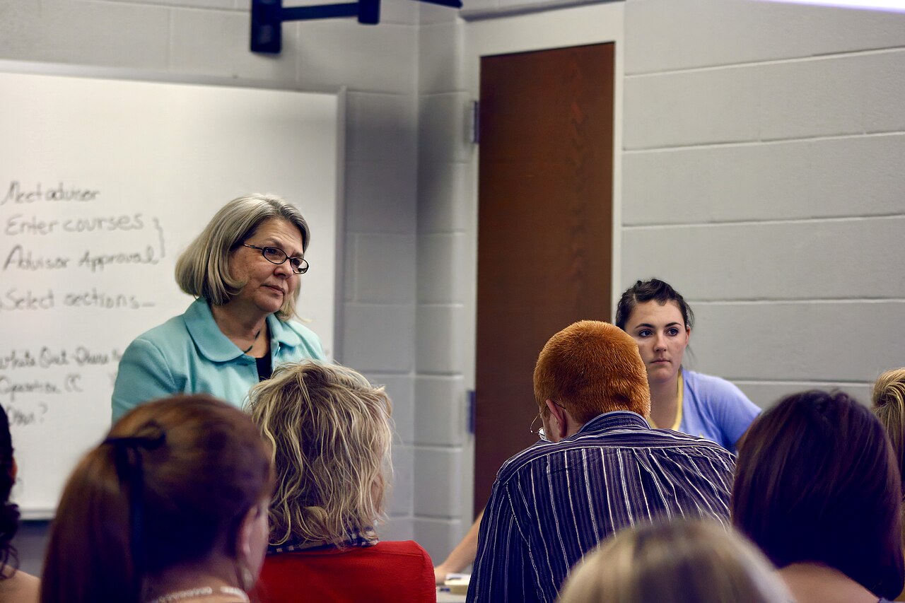 A college professor teaching in a university classroom full of students in Tennessee, United States 12
