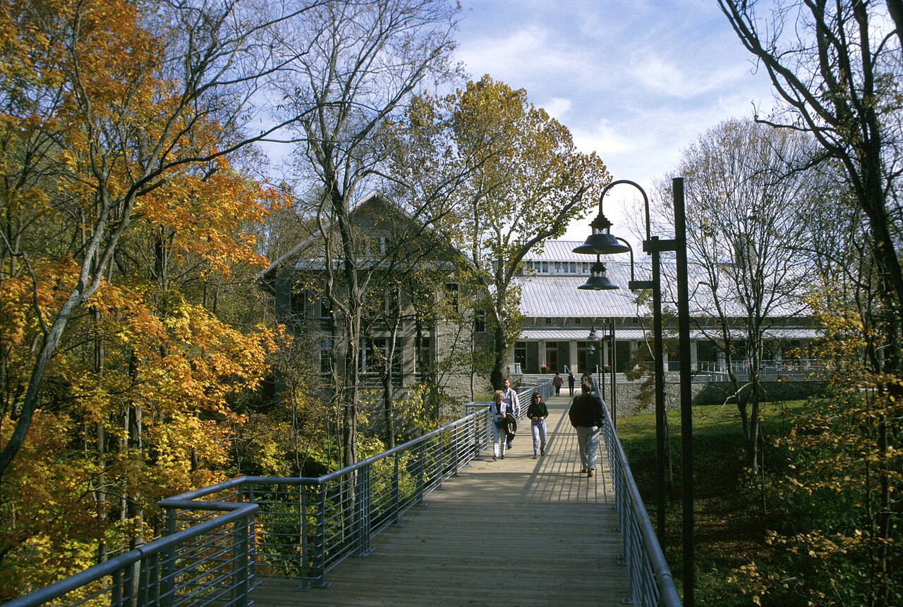 Students crossing bridge in autumn at National Conservation Training Center - DPLA - a1ac1b52f0f380a596c8e1f01