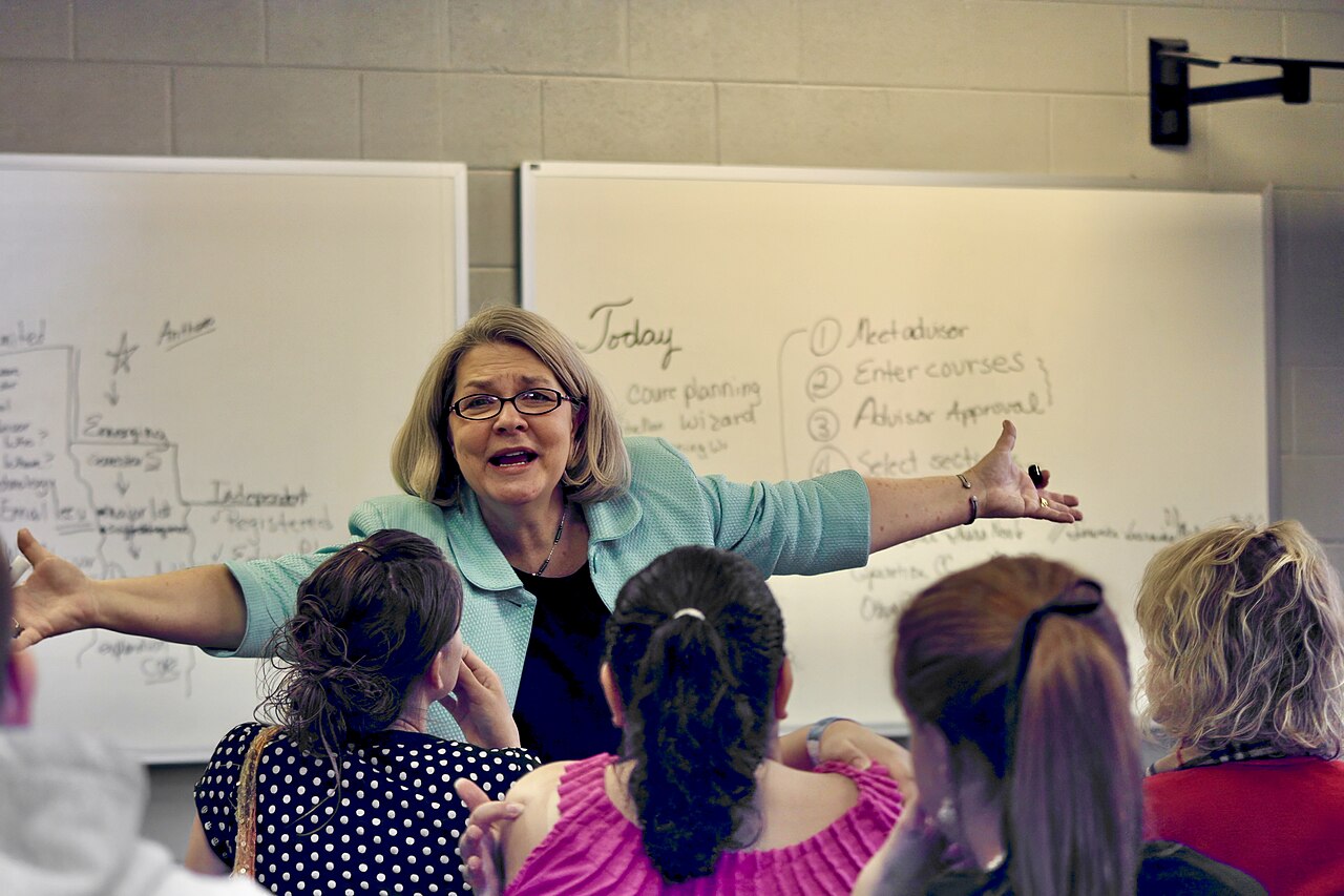 A college professor teaching in a university classroom full of students in Tennessee, United States 03
