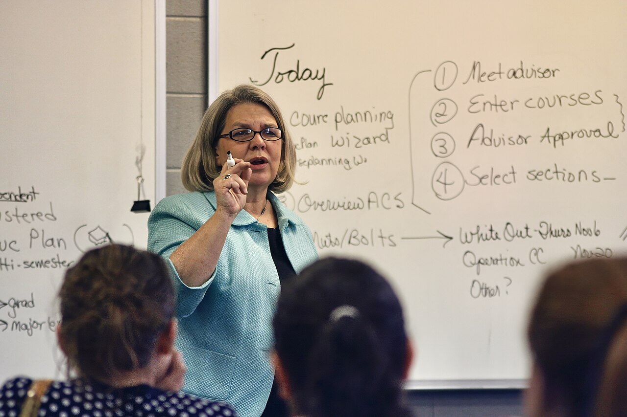 A college professor teaching in a university classroom full of students in Tennessee, United States 06