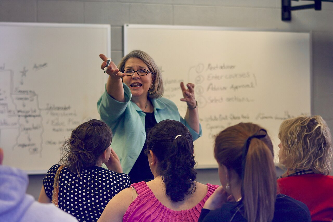 A college professor teaching in a university classroom full of students in Tennessee, United States 02