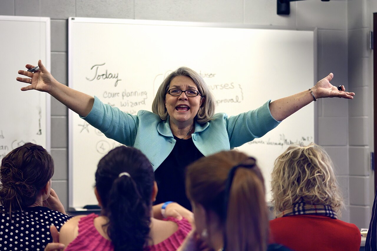 A college professor teaching in a university classroom full of students in Tennessee, United States 04