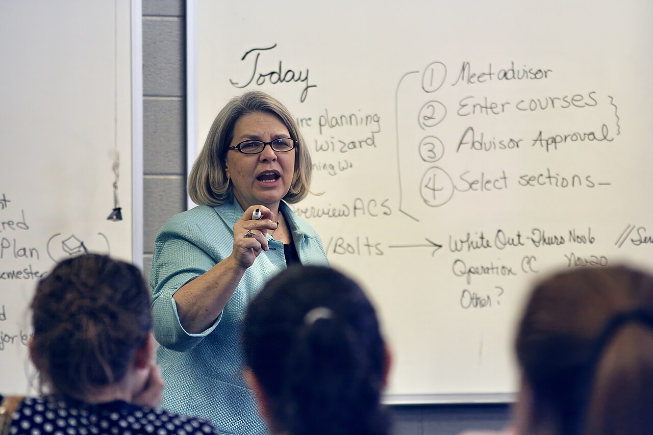 A college professor teaching in a university classroom full of students in Tennessee, United States 07