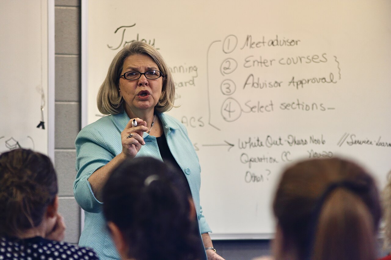 A college professor teaching in a university classroom full of students in Tennessee, United States 01