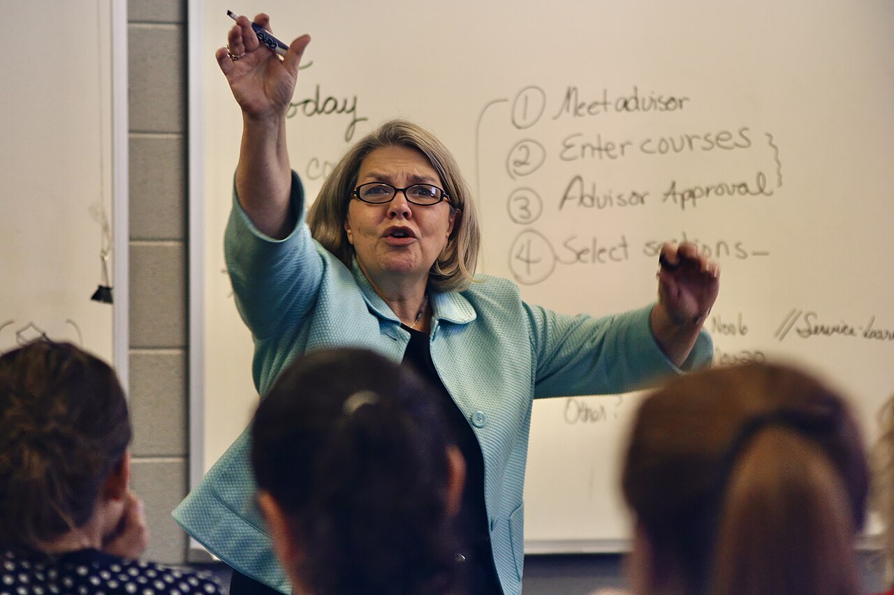 A college professor teaching in a university classroom full of students in Tennessee, United States 05